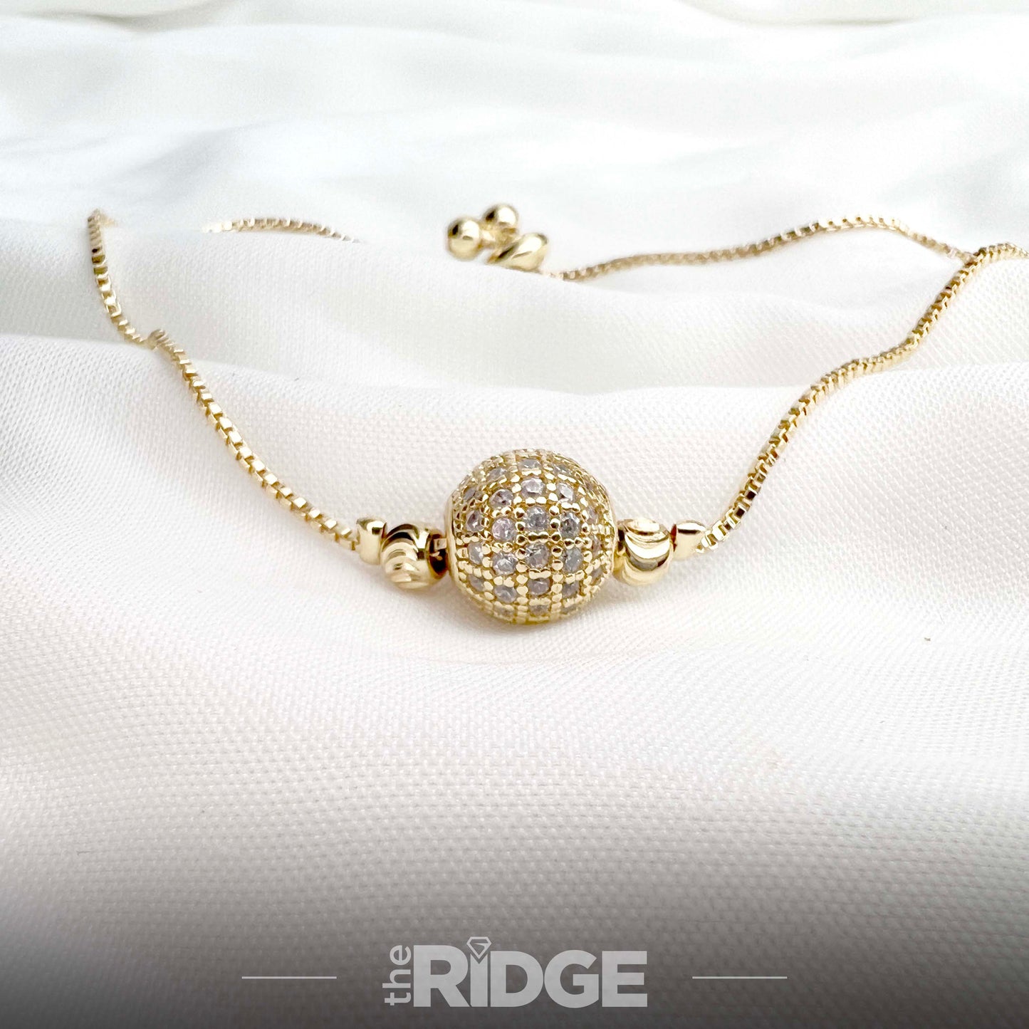 Crystal-Encrusted Gold Ball Charm Bracelet