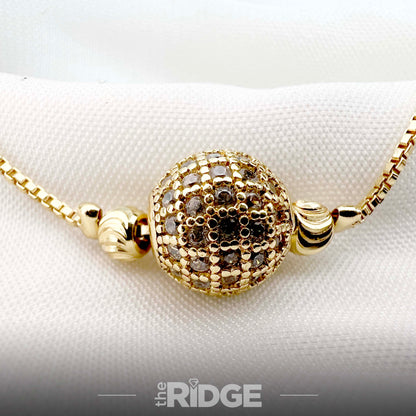Crystal-Encrusted Gold Ball Charm Bracelet