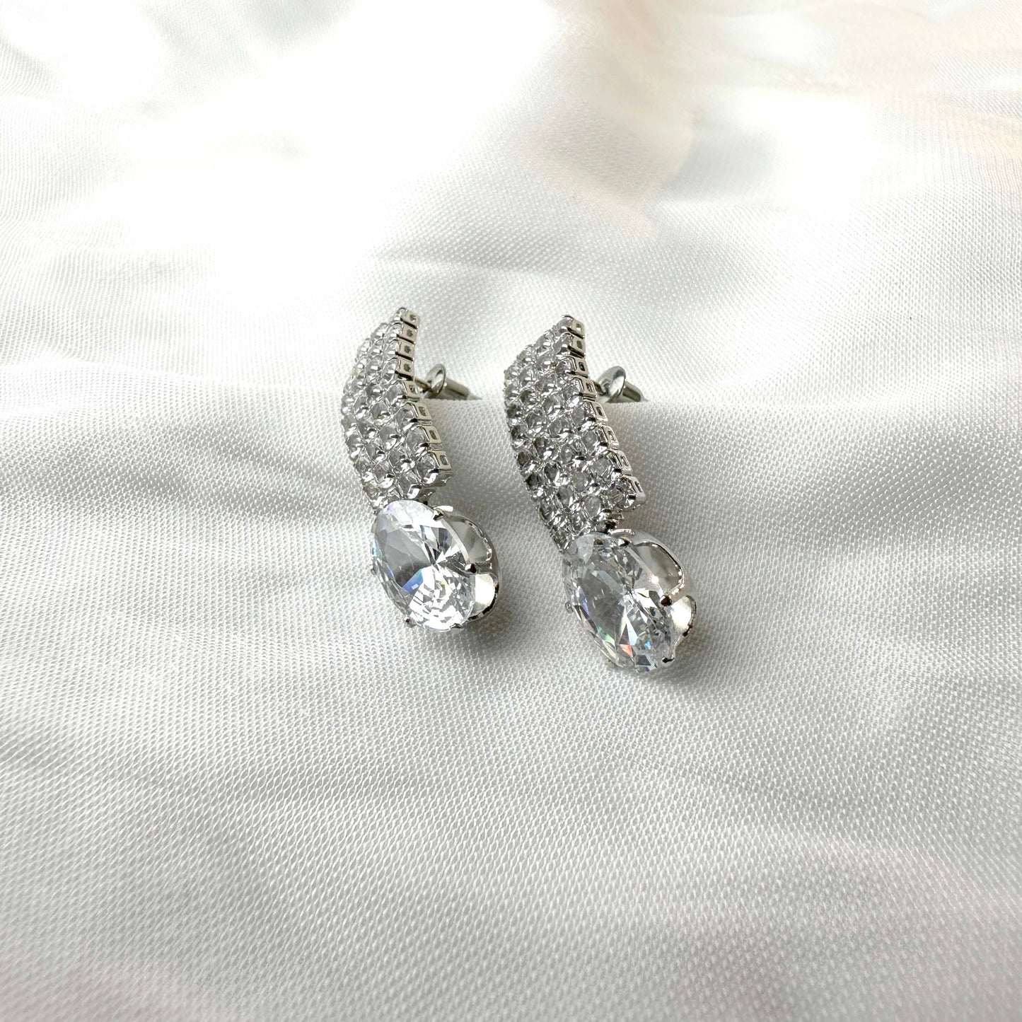 Crystal Curved Drop Earrings – Silver