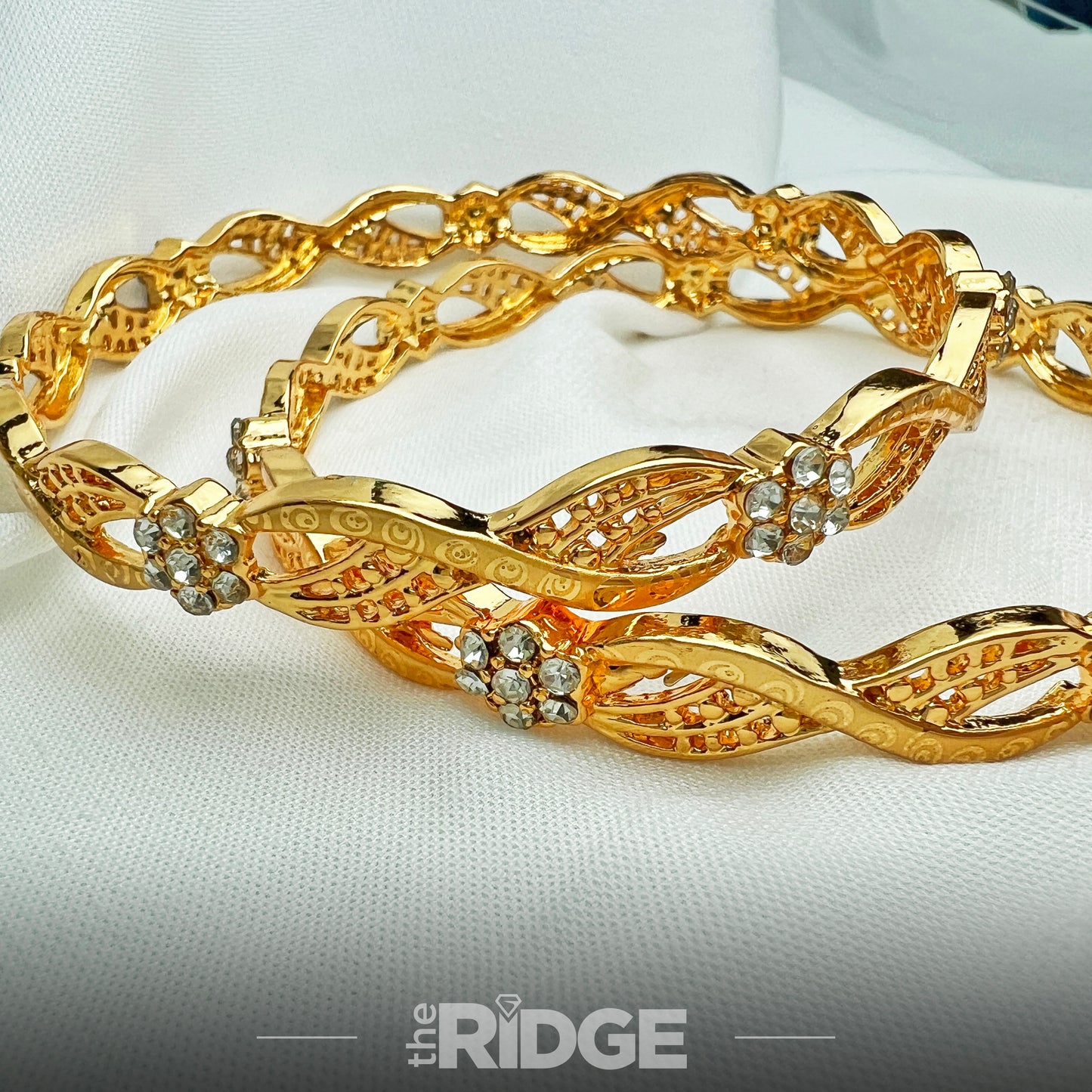 Infinity Twist Bangle – Floral Crystals